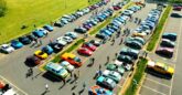 Drone shot of carpark filled with different styles of cars