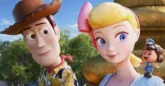 The heads of an animated cowboy waring a hat next to a blonde lady with a pink bow in her hair with a tiny policewoman on her shoulder