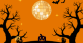 Cartoon disco ball hanging from an orange sky with black trees and and black jack-a-lantern in the background