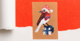 handmade collaged festive card of a robin sitting on a wrapped present.