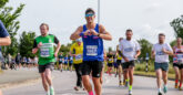 Group of runners, entering bend in route of Southend Half Marathon, along Southend Seafront